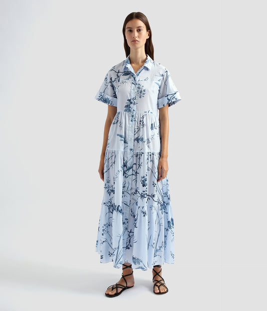 A feminine twist on a masculine shirt, this short sleeve tiered dress features a collar and button down front. Made from cotton poplin, its lightweight and perfect for summer. 