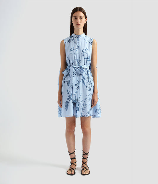 A sleeveless shirt dress by designer Erdem. Made from floral cotton silk voile with a button down front, this sleeveless shirt dress has a tie waist and stand collar. 