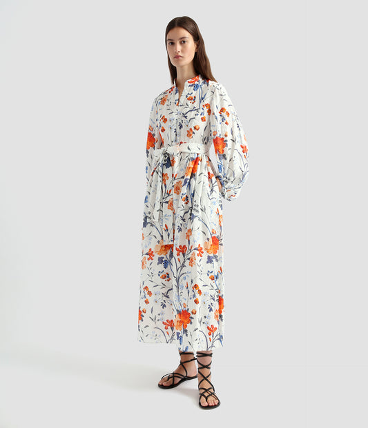 A long sleeve midi dress by designer Erdem. Perfect for the summer, this long sleeve midi dress is crafted from linen with bright blue and ornage florals on a white background. 