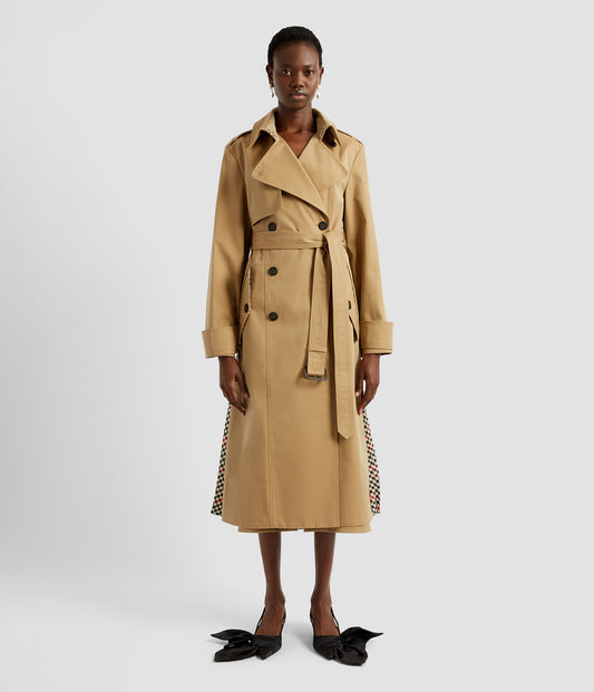 Pleated trench coat by designer ERDEM. From the front it looks like a traditional trench coat, with a classic silhouette but a contrasted checked wool pleated panel is just visible at the sides. 