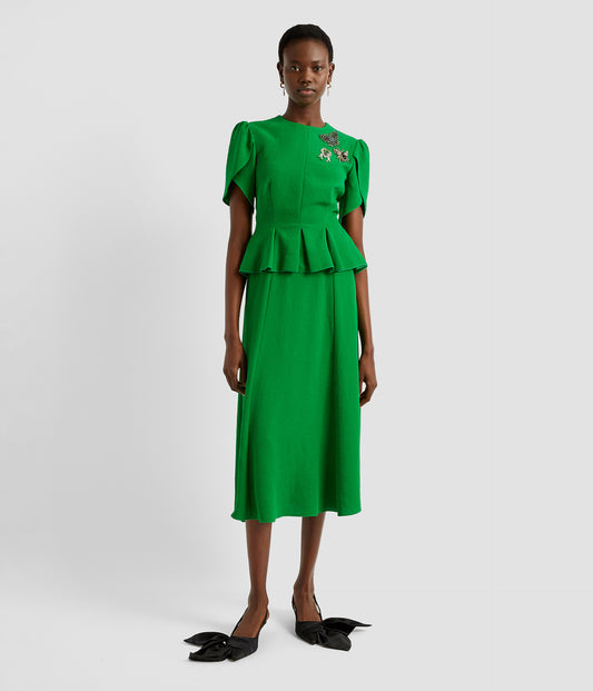 Peplum midi dress in a bright green from designer ERDEM. The dress features a midi skirt, peplum and tulip sleevs with crystal insect brooches around the neckline. 