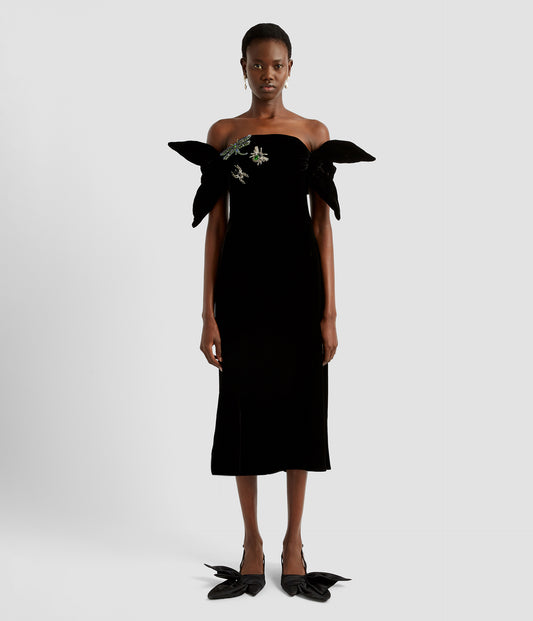 Off the shoulder, bardot dress in black velvet by designer ERDEM. Fitted in the bodice and midi skirt with crystal embellished insects on the bodice. 