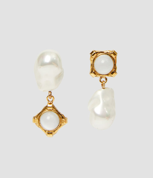 Pearl and stone earrings by designer ERDEM. These gold-tone earrings feature a drop pearl and gold set stone, with each earring being the opposite of the other. Classic but fun, they will elevate any outfit. 
