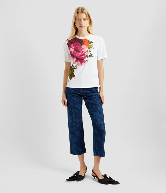 An elevated short sleeve cotton t-shirt by designer Erdem. With a classic crew neck and boxy fit, this tshirt features an oversized fuschia and rose print across one shoulder. 