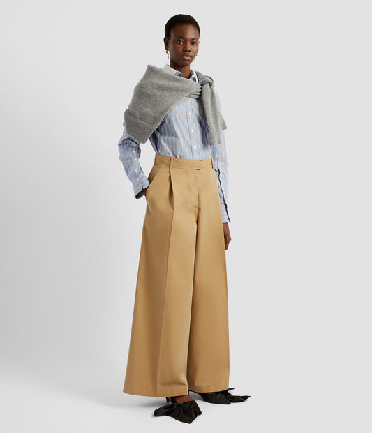 Wide length trousers with long length that falls at the ankle. The wide leg trousers are cut from camel cotton-twill with a fitted mid rise waist, pockets and dramatic pleats.