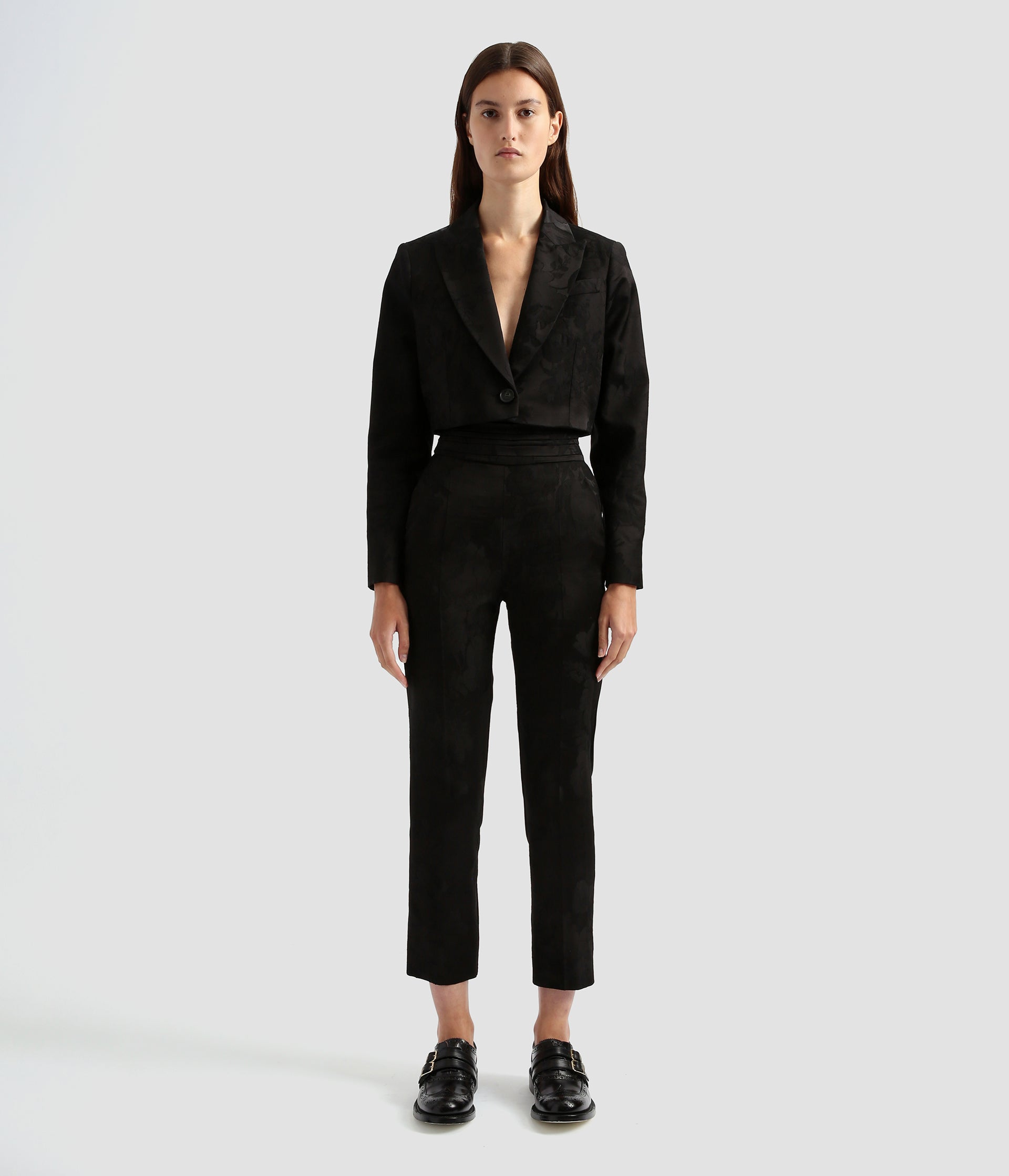 Tailored cropped boxy jacket by the designer Erdem. It's a contemporary take on the classic single breasted blazer with a dramatic crop and deep v neck.  Worn here with the matching tailored slim fit trousers. 