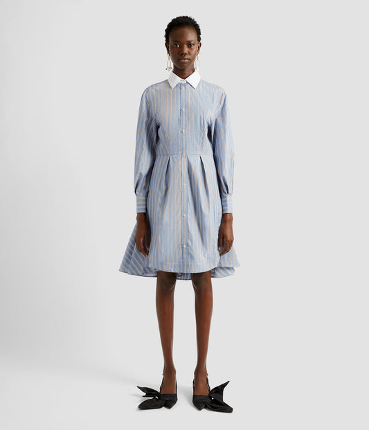 Mini shirt dress in blue striped cotton poplin with a contrasting white collar. The button down front mini dress is an elevated twist on the classic men's shirt. 
