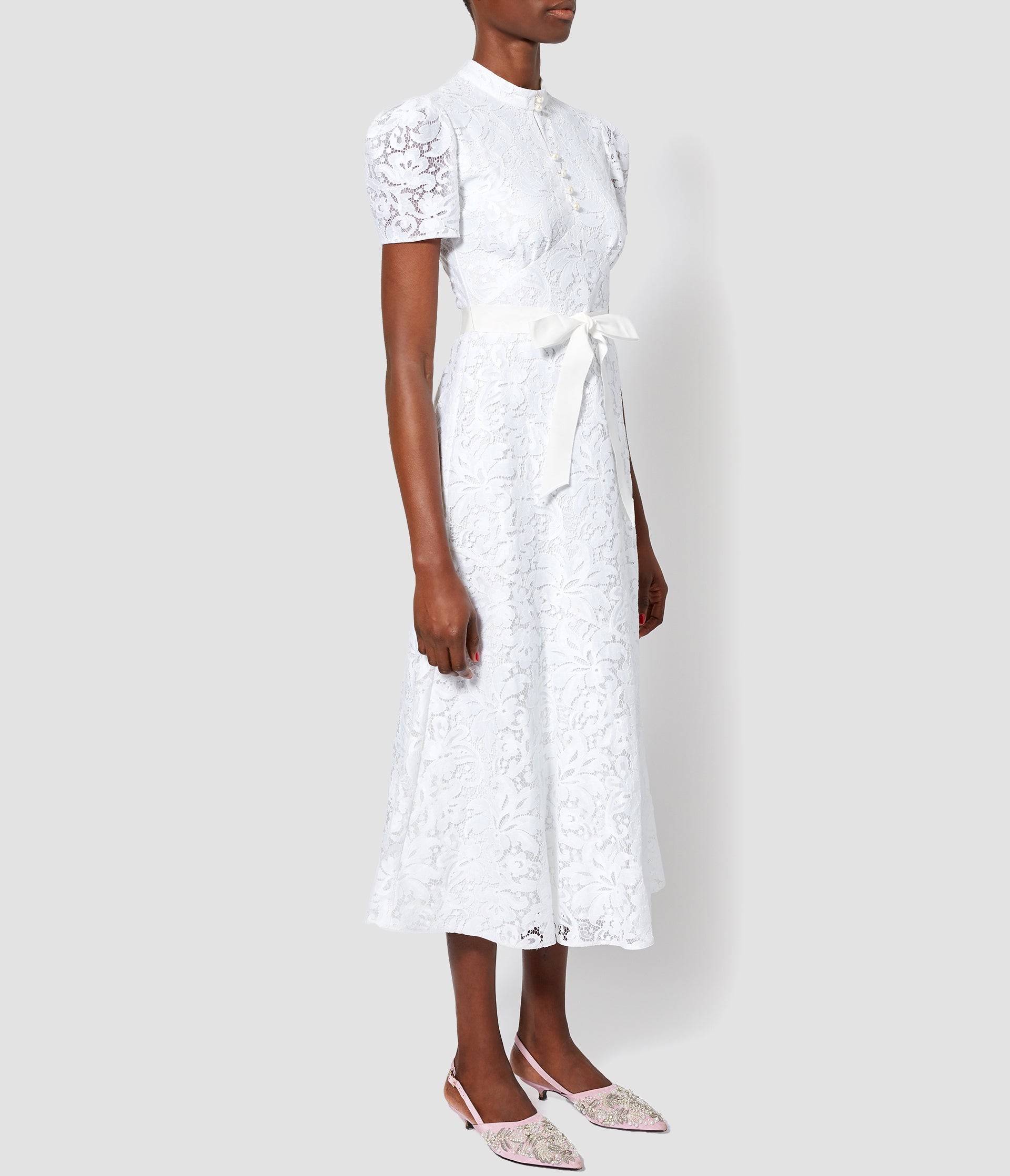 Part of the ERDEM white collection, this white lace puff sleeve dress is the perfect addition to a wedding wardrobe for rehearsal dinners or a more casual ceremony. 