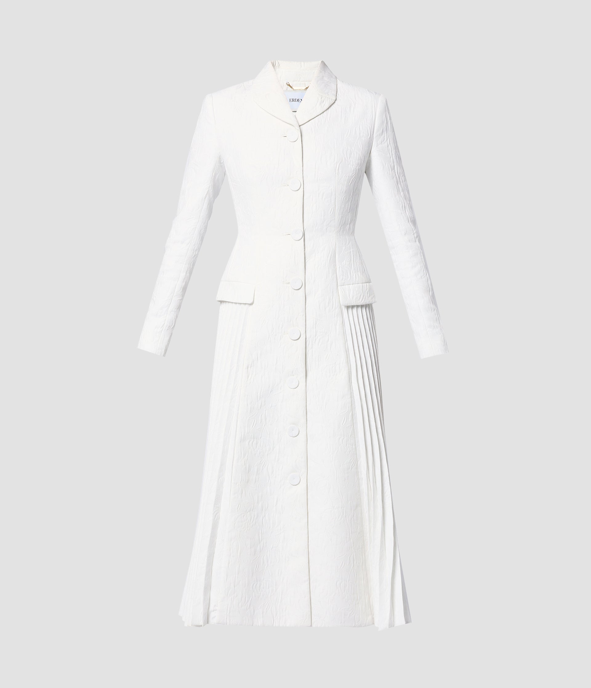 The Calla Coat by designer Erdem is the perfect addition to a bridal wardrobe. In heavy ivory cloque, this white wedding coat is a single breasted white bridal coat with a flattering pleated detail down at the side.